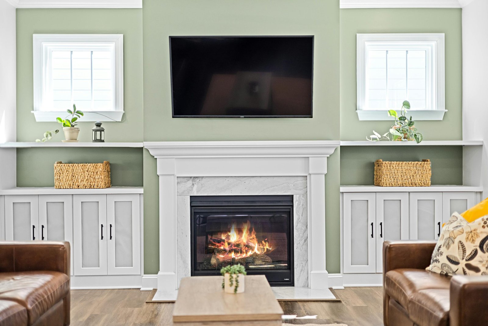 Large screen tv professionally mounted over fire place by an installer in Durham, On.